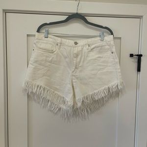 Blank NYC White Denim Shorts with Frayed Hem.